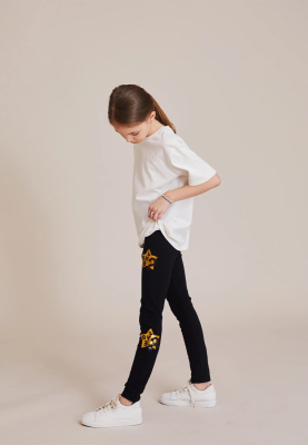 Леггинсы с золотыми звездами в черном цвете