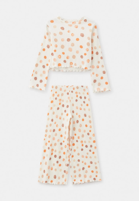 Комплект из блузки и брюк с разноцветными шариками в белом цвете