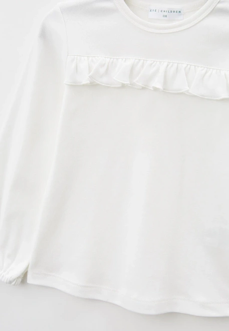 Лонгслив из хлопкового трикотажа молочного цвета с рюшкой на полочке