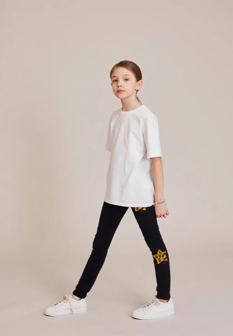 Леггинсы с золотыми звездами в черном цвете