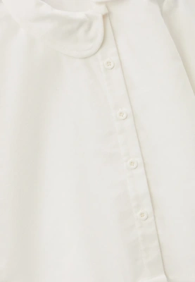 Блузка из теплого хлопка с круглым воротником и застежкой смещенной в бок