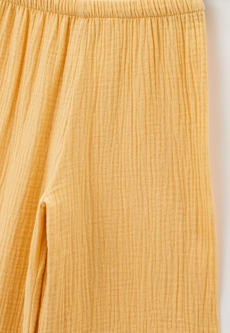 Брюки широкие из муслина бледно-желтого цвета