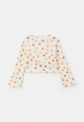 Комплект из блузки и брюк с разноцветными шариками в белом цвете