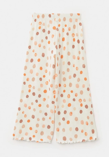 Комплект из блузки и брюк с разноцветными шариками в белом цвете