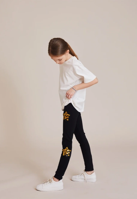 Леггинсы с золотыми звездами в черном цвете