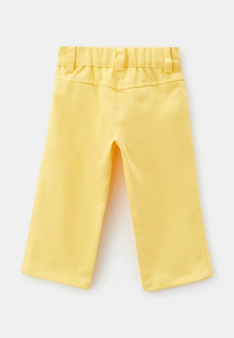 Брюки из денима желтого цвета