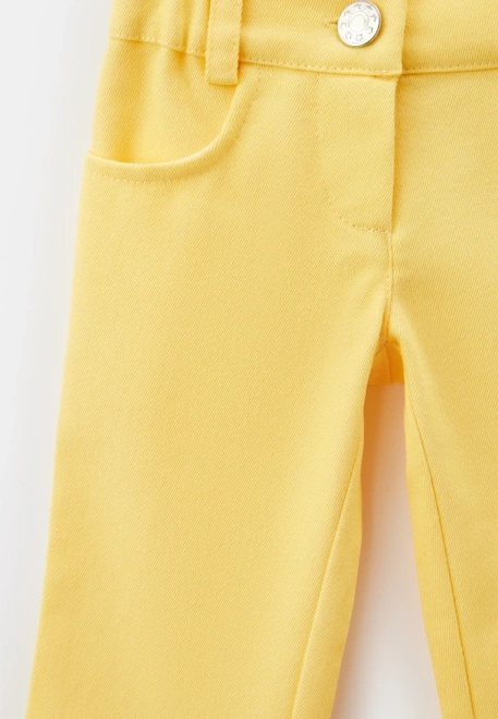 Брюки из денима желтого цвета