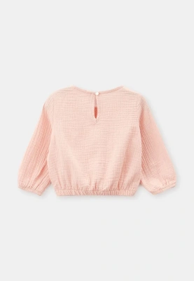 Блузка из муслина в розовом цвете